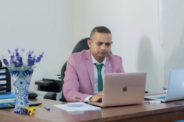 Hemraj Poudel at his desk